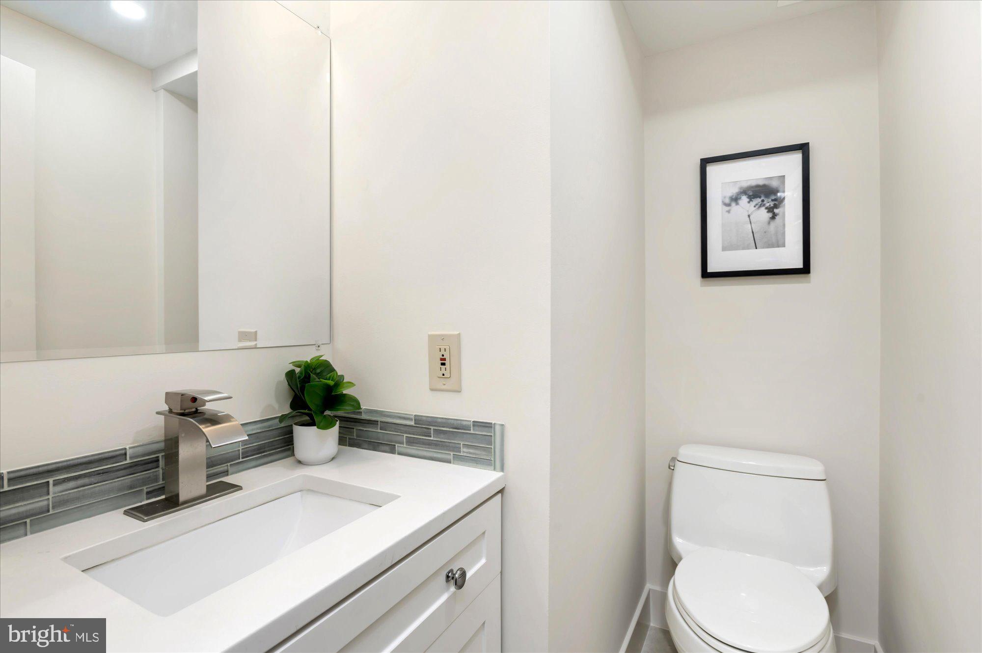 1913 Kalorama Place Northwest, Unit 13 Washington, DC 20009 - Photo 19 of 33 a bathroom with a sink toilet and vanity