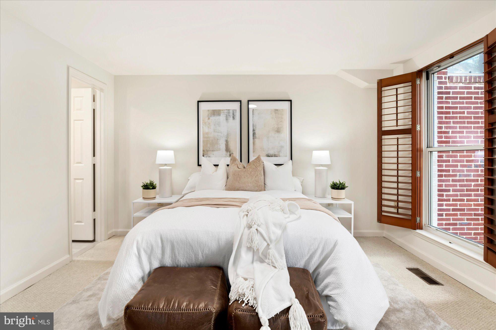 1913 Kalorama Place Northwest, Unit 13 Washington, DC 20009 - Photo 23 of 33 a bedroom with a bed and a large window