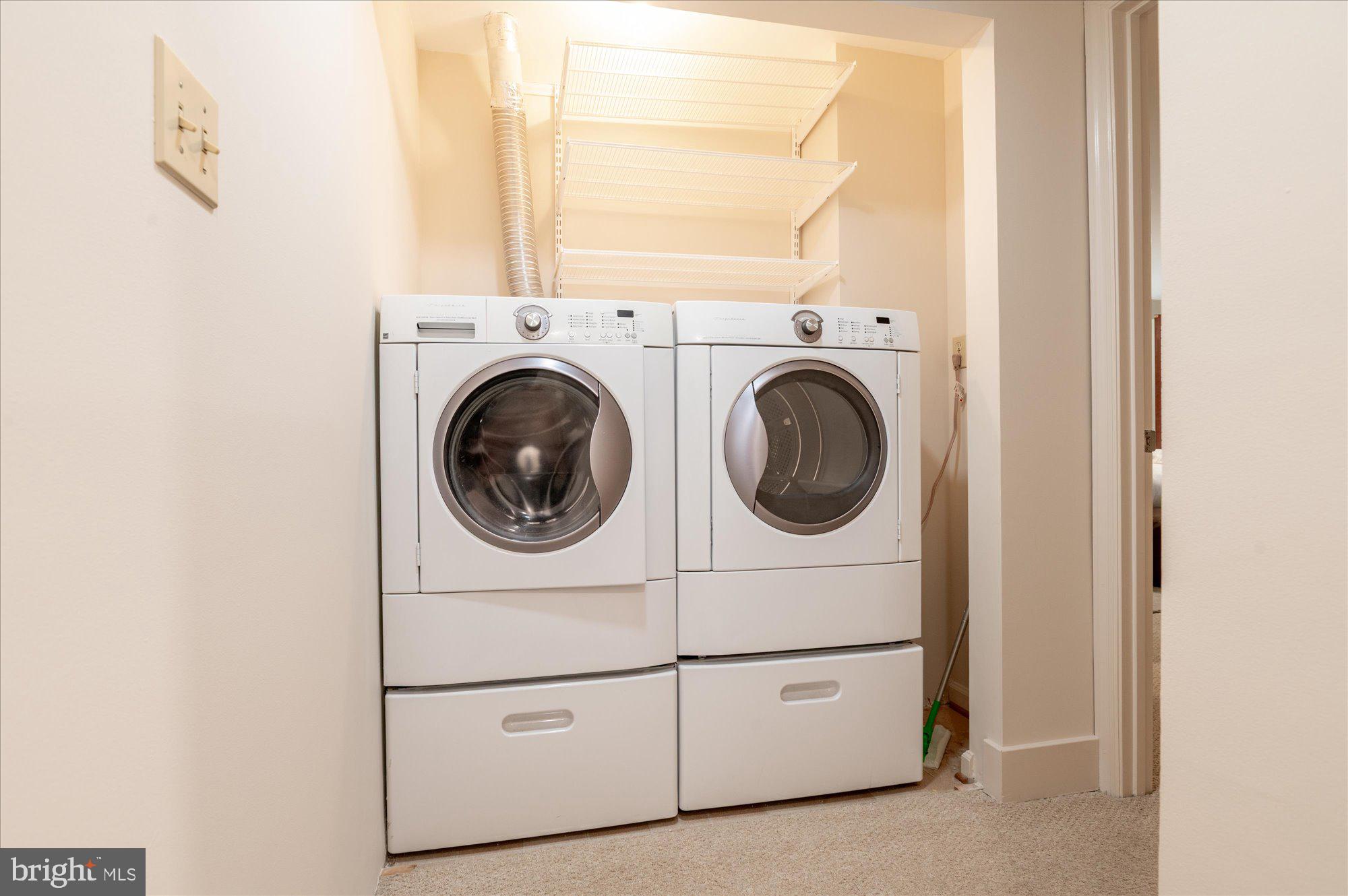 1913 Kalorama Place Northwest, Unit 13 Washington, DC 20009 - Photo 25 of 33 a utility room with dryer and washer