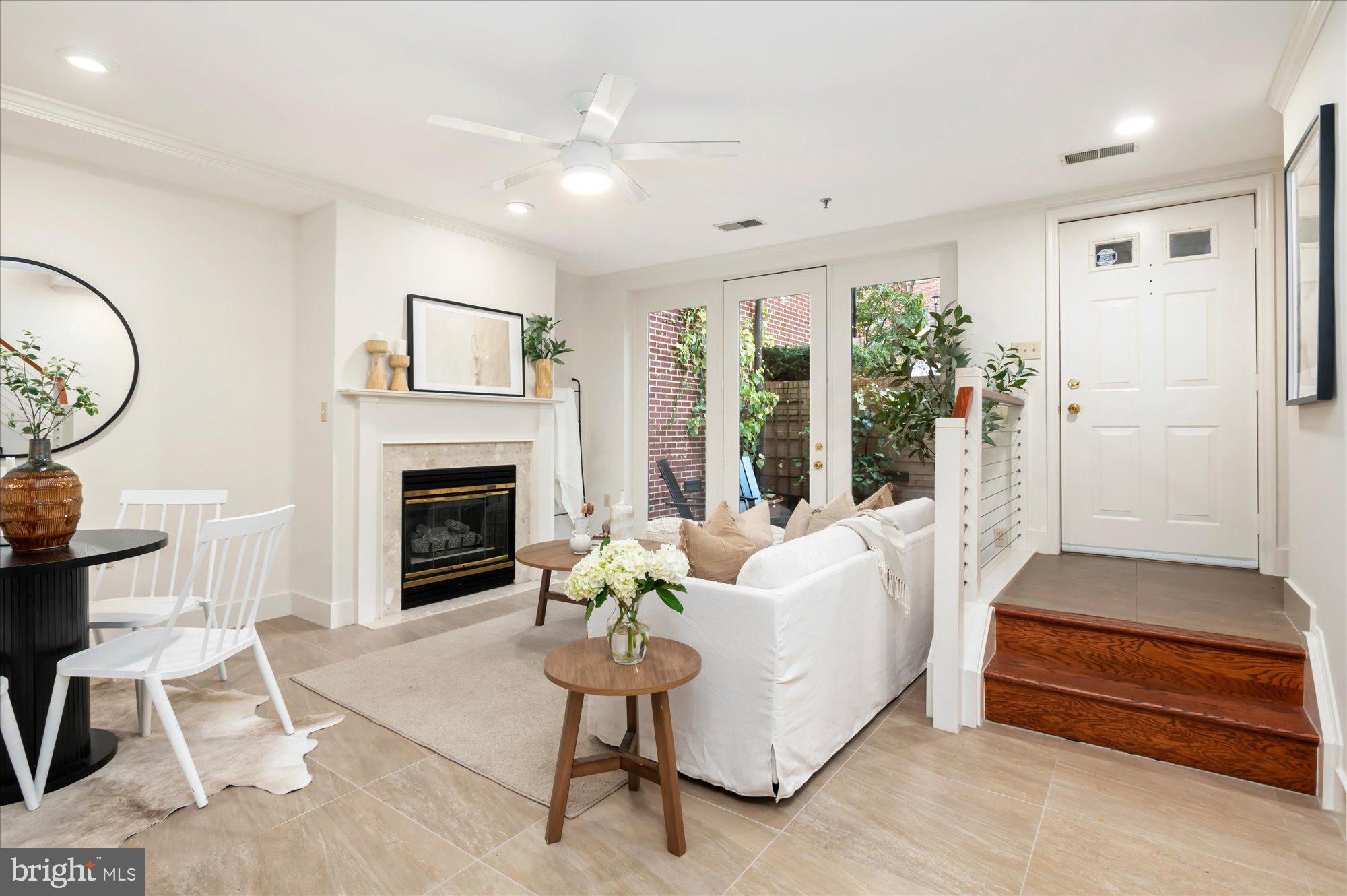 1913 Kalorama Place Northwest, Unit 13 Washington, DC 20009 - Photo 5 of 33 a living room with furniture and a fireplace