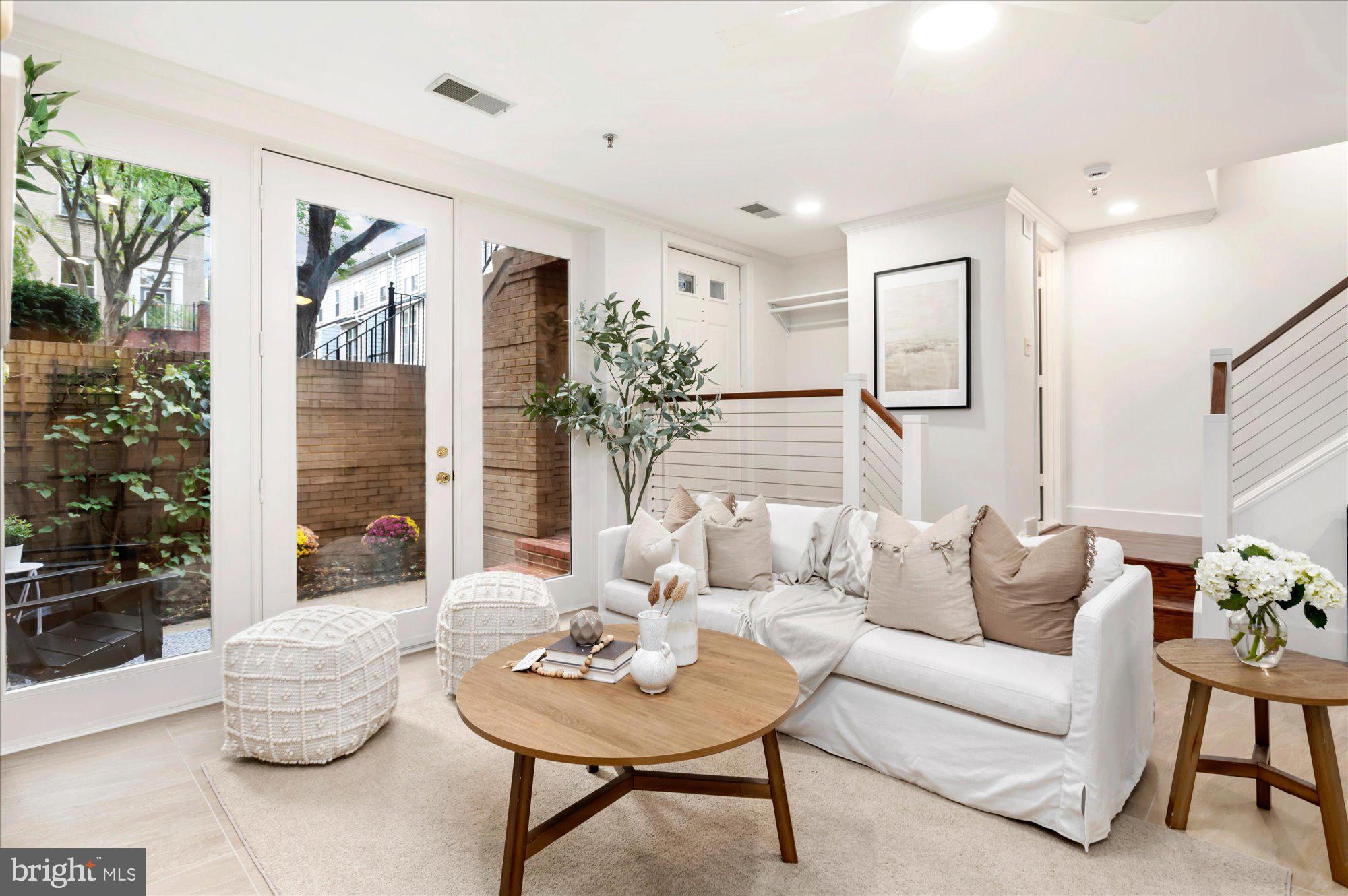 1913 Kalorama Place Northwest, Unit 13 Washington, DC 20009 - Photo 7 of 33 a living room with furniture and a table