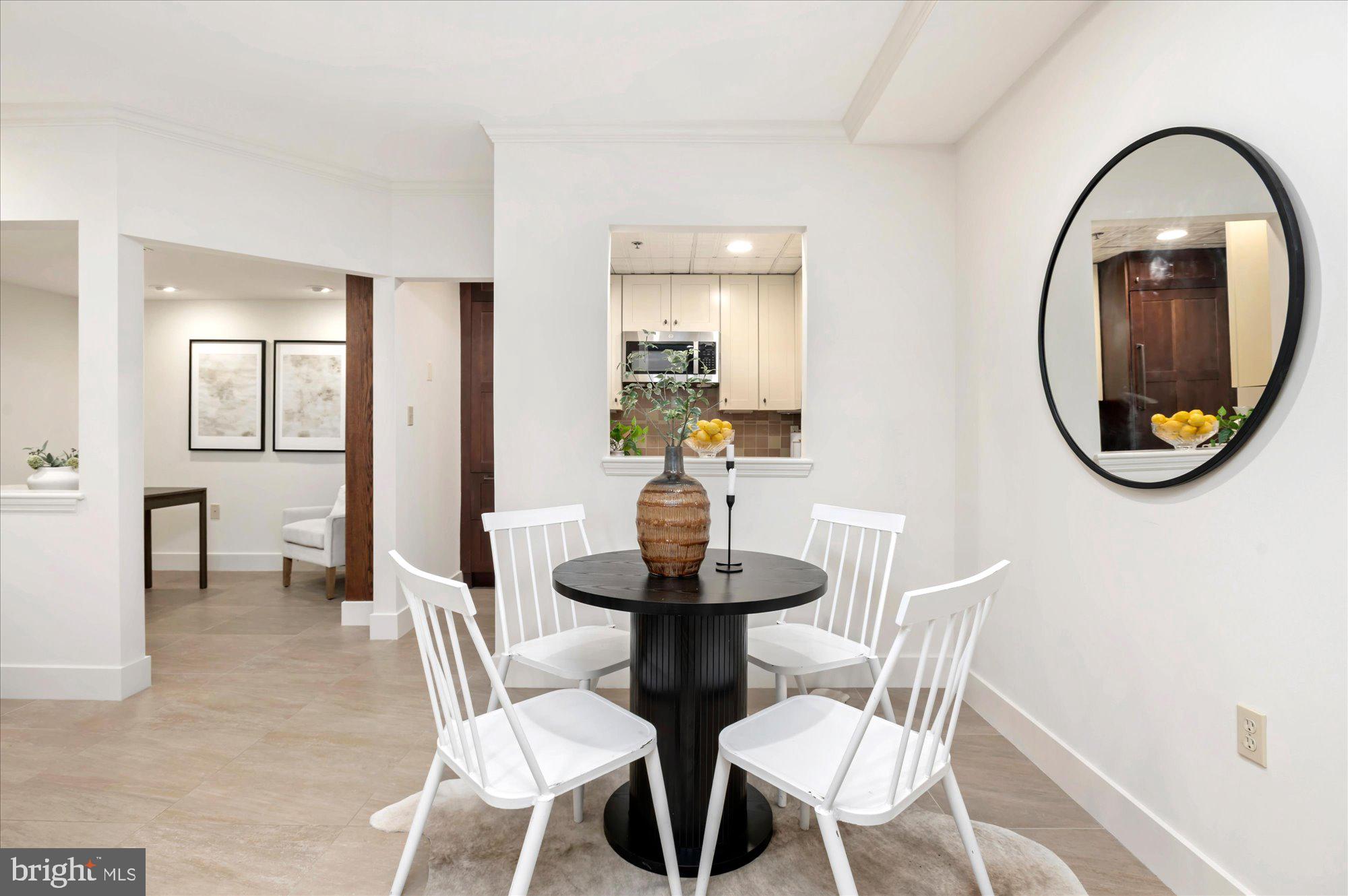 1913 Kalorama Place Northwest, Unit 13 Washington, DC 20009 - Photo 9 of 33 a view of a dining room with furniture and a mirror