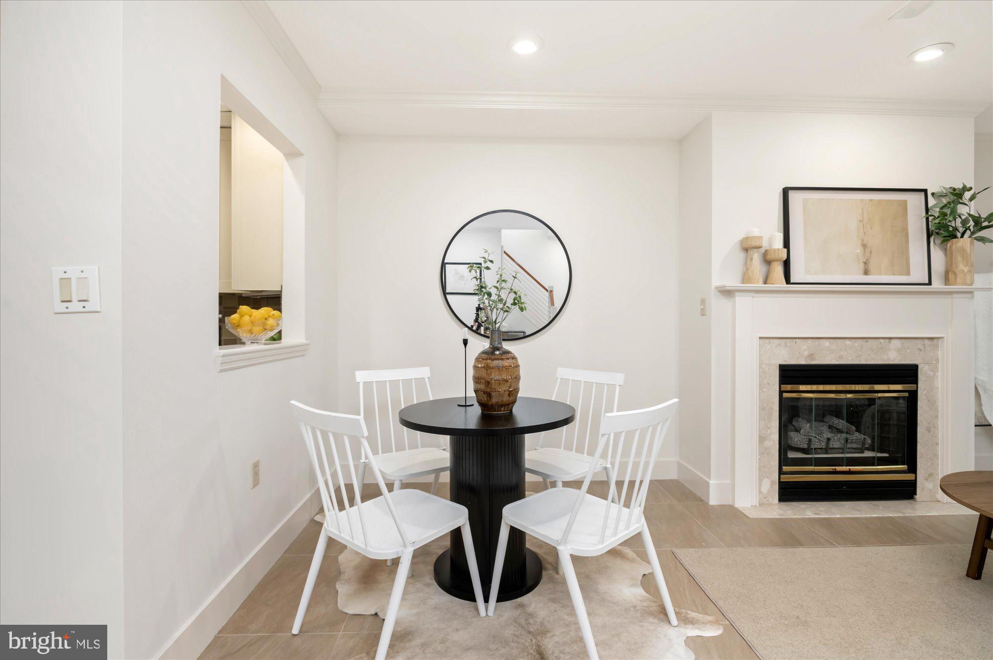 1913 Kalorama Place Northwest, Unit 13 Washington, DC 20009 - Photo 10 of 33 a view of a livingroom with furniture and a fireplace