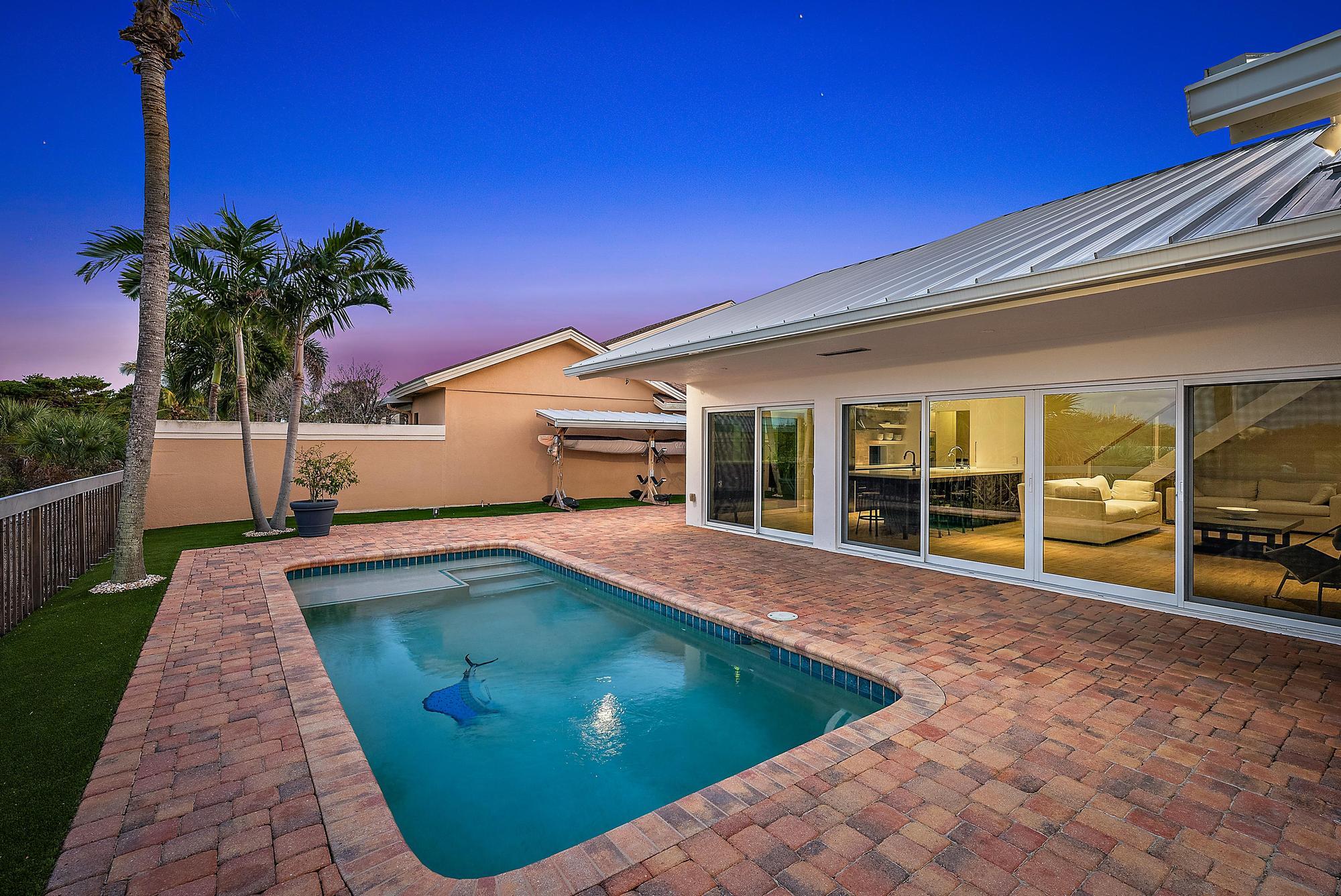 223 Ridge Road Jupiter, FL 33477 - Photo 32 of 46 Exterior Pool at Twilight