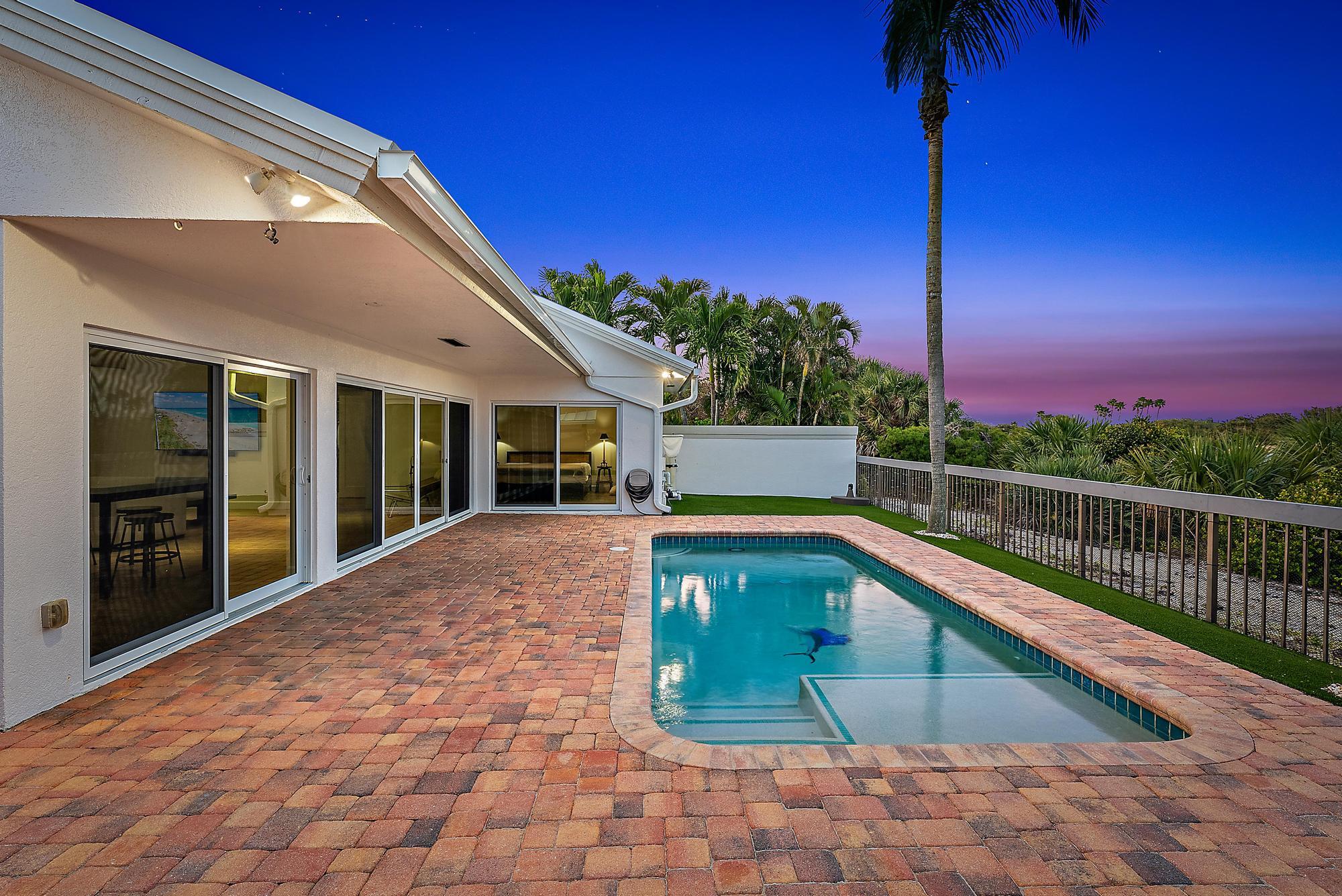 223 Ridge Road Jupiter, FL 33477 - Photo 4 of 46 Exterior Pool at Twilight