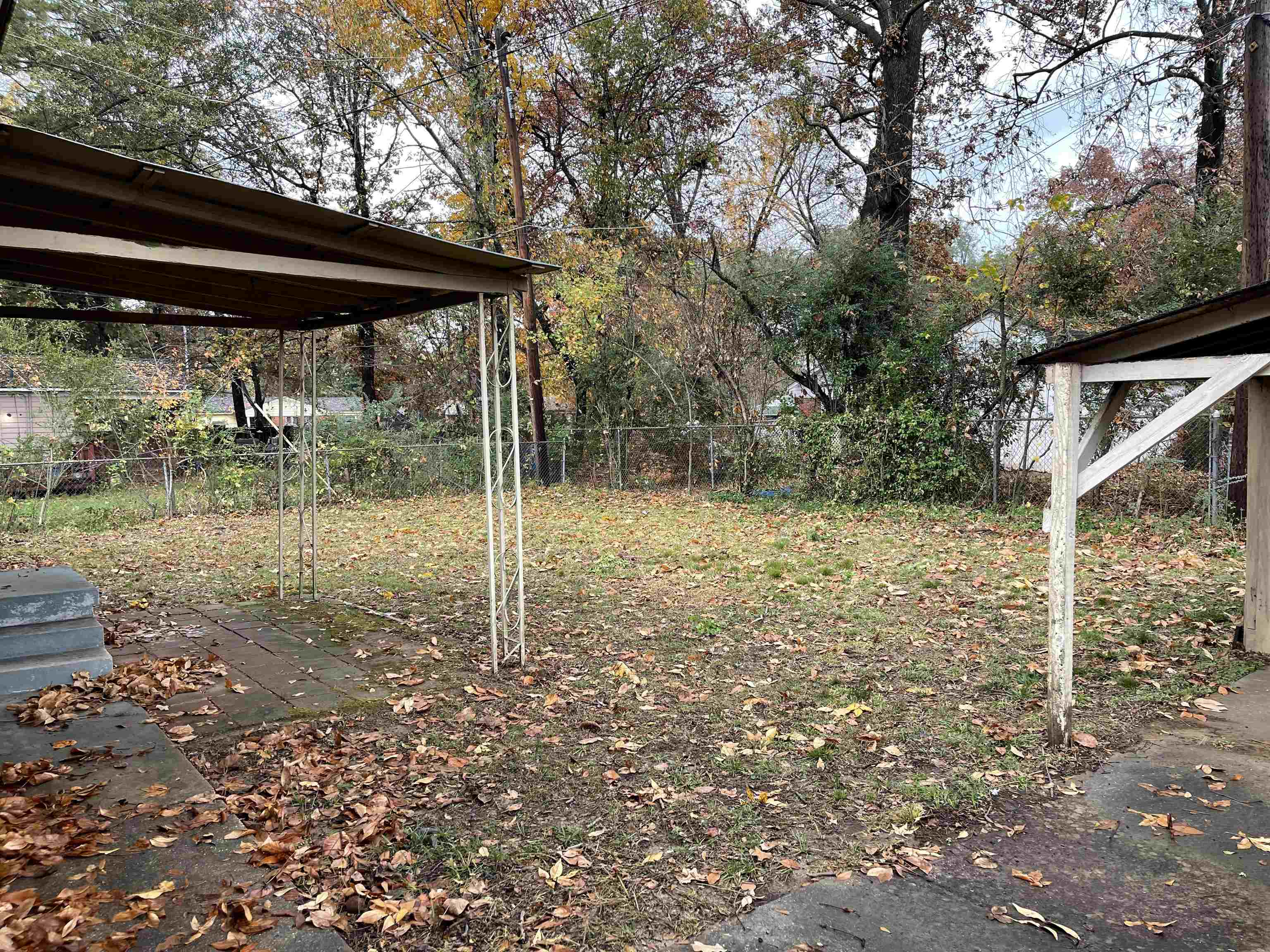 1624 Winfield Road Memphis, TN 38116 - Photo 2 of 14 a backyard of a house with plants and outdoor seating
