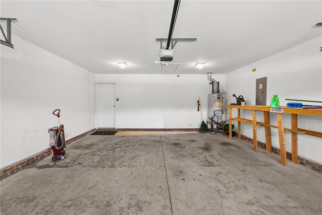 113 Crofton Court Easley, SC 29642 - Photo 21 of 33 This spacious garage offers ample storage and easy access with its convenient features.