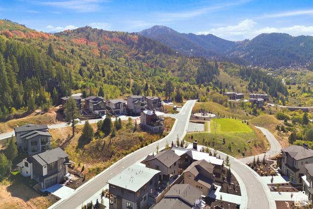 4092 Discovery Way Park City, UT 84098 - Photo 60 of 66 Mountainous terrain with mature trees, modern residential architecture, paved roadways, and landscaped common areas