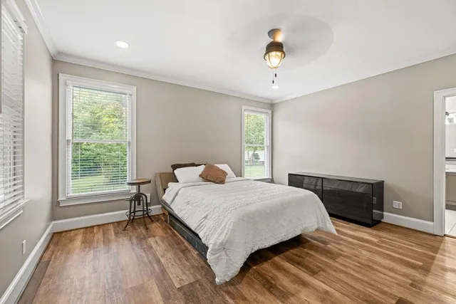 a bathroom with a sink toilet and a mirror