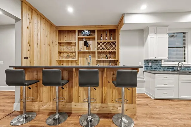 a kitchen with granite countertop a cabinets and window