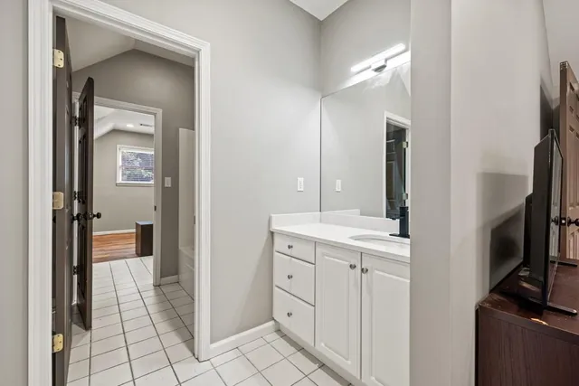 a view of a patio with table and chairs and wooden floor