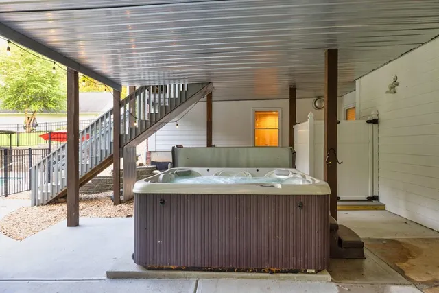 a view of a house with a yard patio and sitting area