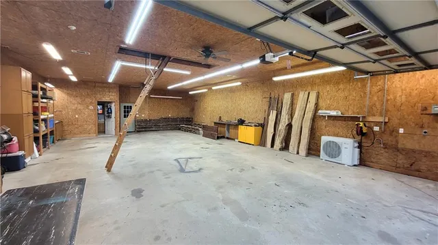 a front view of a house with a yard table and chairs