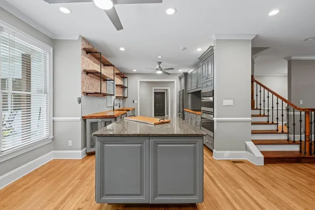 a kitchen with a stove and a refrigerator