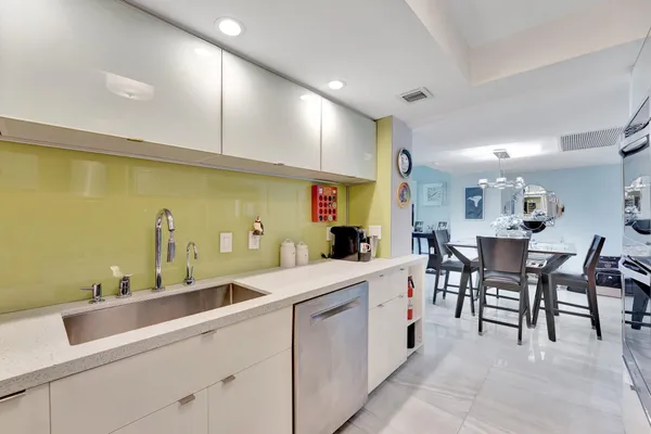 a kitchen with a table and chairs