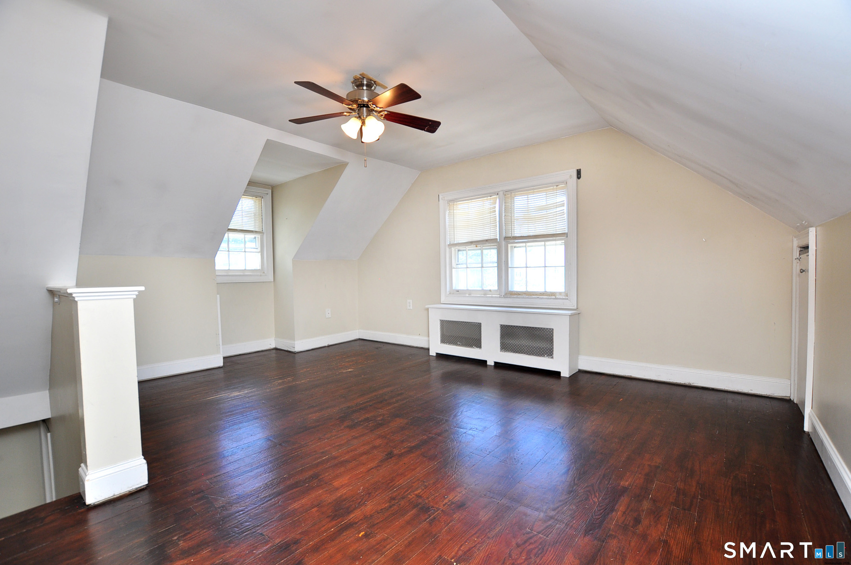 103 West Center Street Manchester, CT 06040 - Photo 28 of 29 a view of an empty room with wooden floor and a window