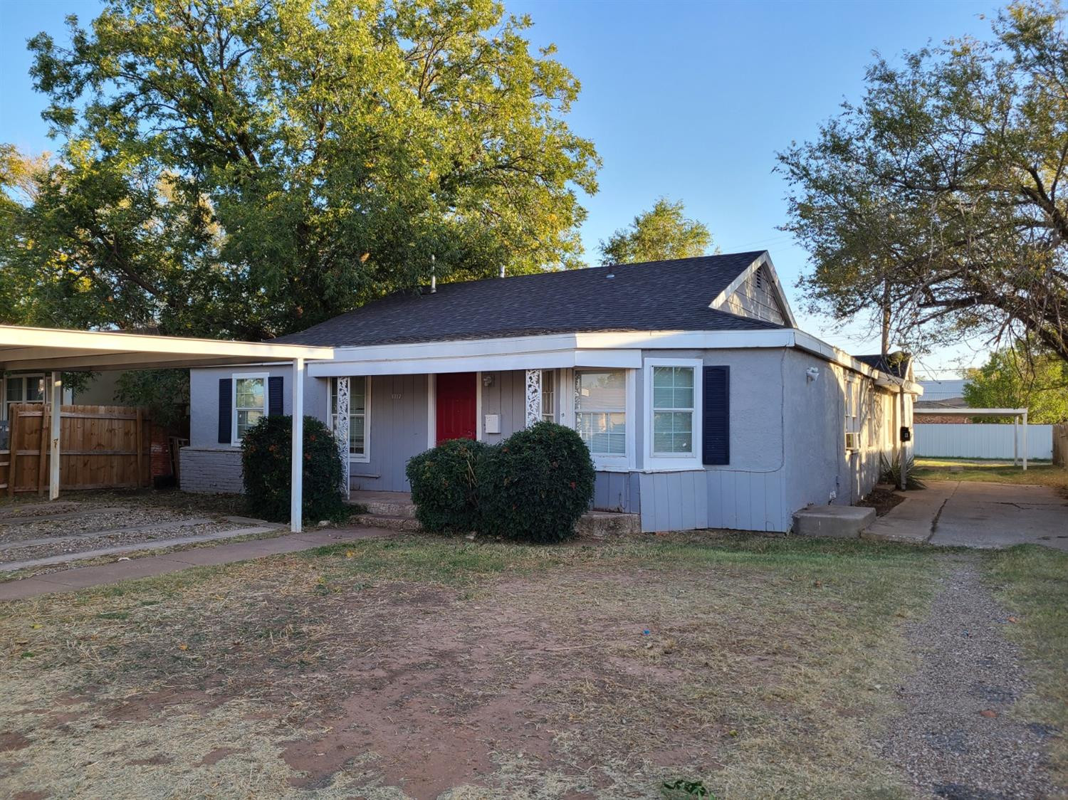 1717 47th Street Lubbock, TX 79412 - Photo 1 of 3 a view of a house with a yard and large tree