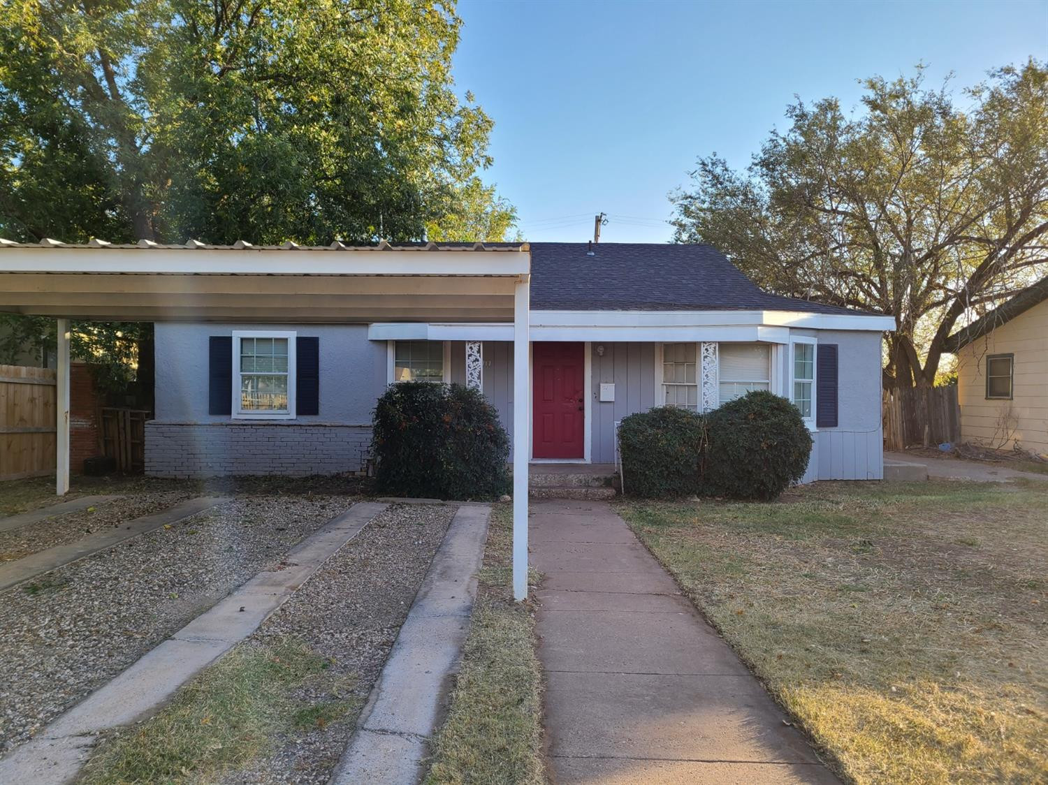 1717 47th Street Lubbock, TX 79412 - Photo 2 of 3 a view of a house with a yard and large tree