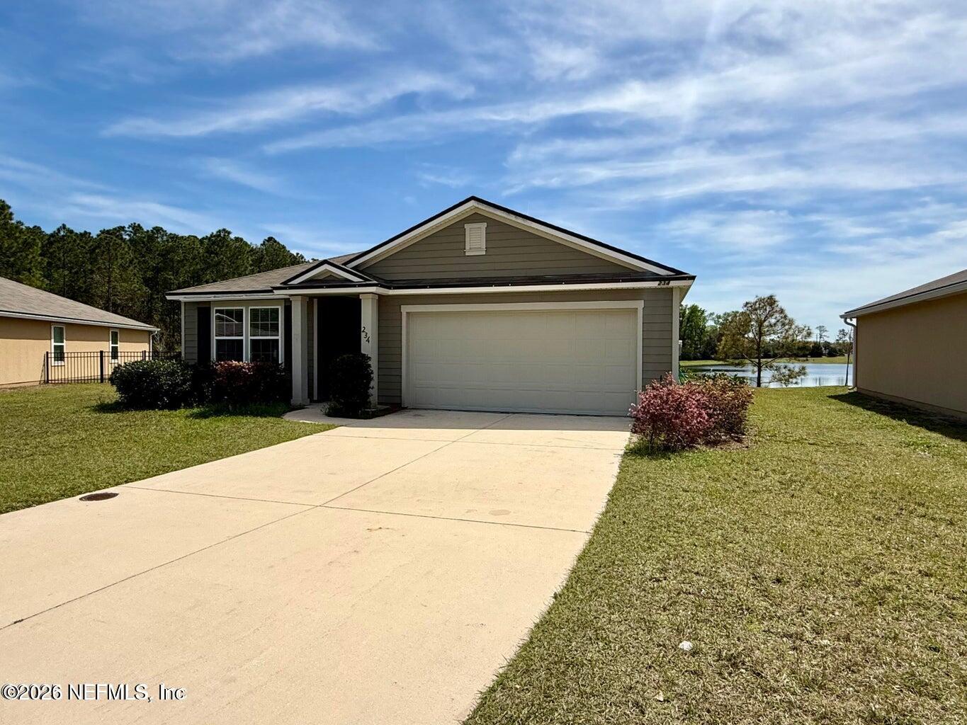 234 Cody Street St. Augustine, FL 32084 - Photo 3 of 20 a front view of a house with a yard