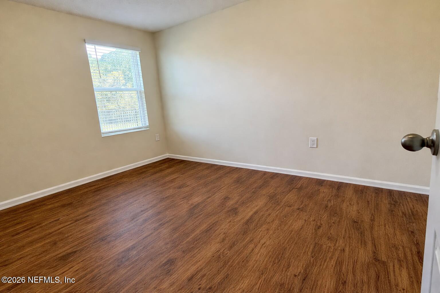 234 Cody Street St. Augustine, FL 32084 - Photo 10 of 20 wooden floor in an empty room with a window