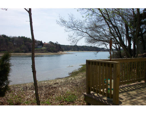 24 F Hideaway Road Bourne, MA 02532 - Photo 3 of 4 a view of a lake from a balcony