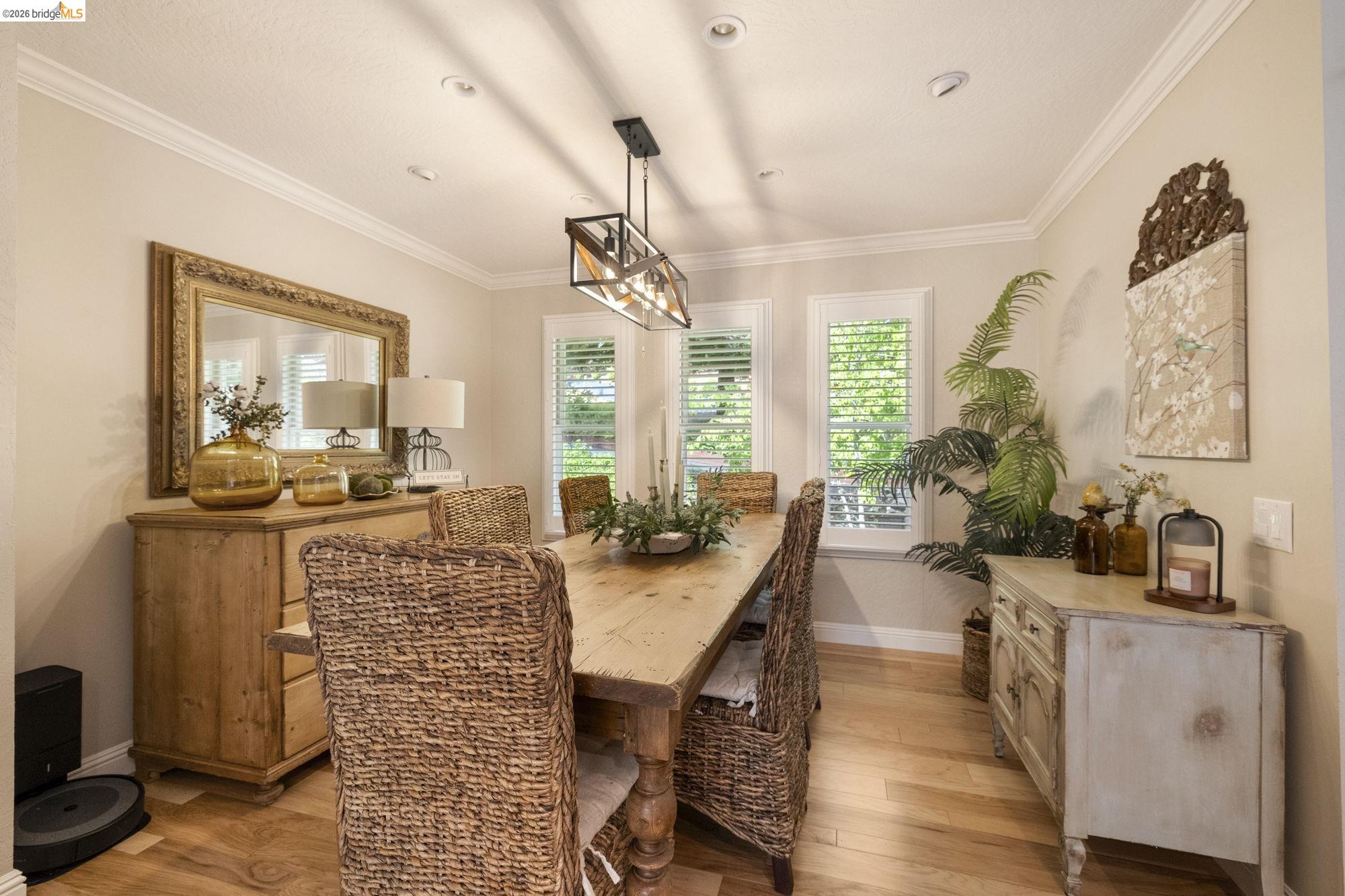 20581 Gerber Road Tuolumne, CA 95379 - Photo 13 of 60 Dining area featuring ornamental molding, light wood-style flooring, recessed lighting, and a chandelier