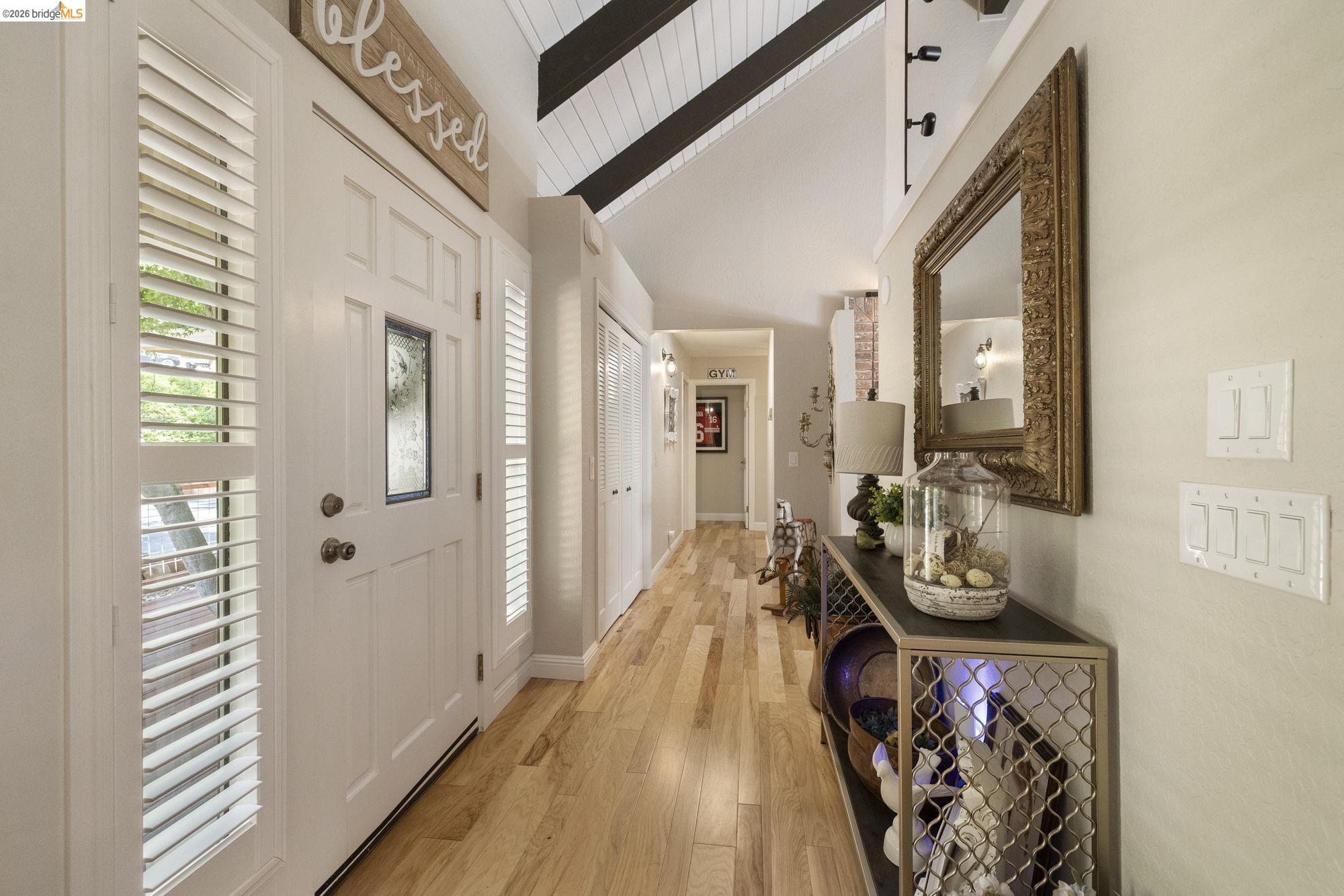 20581 Gerber Road Tuolumne, CA 95379 - Photo 15 of 60 Foyer entrance featuring light wood-style flooring, high vaulted ceiling, and a wooden ceiling with exposed beams