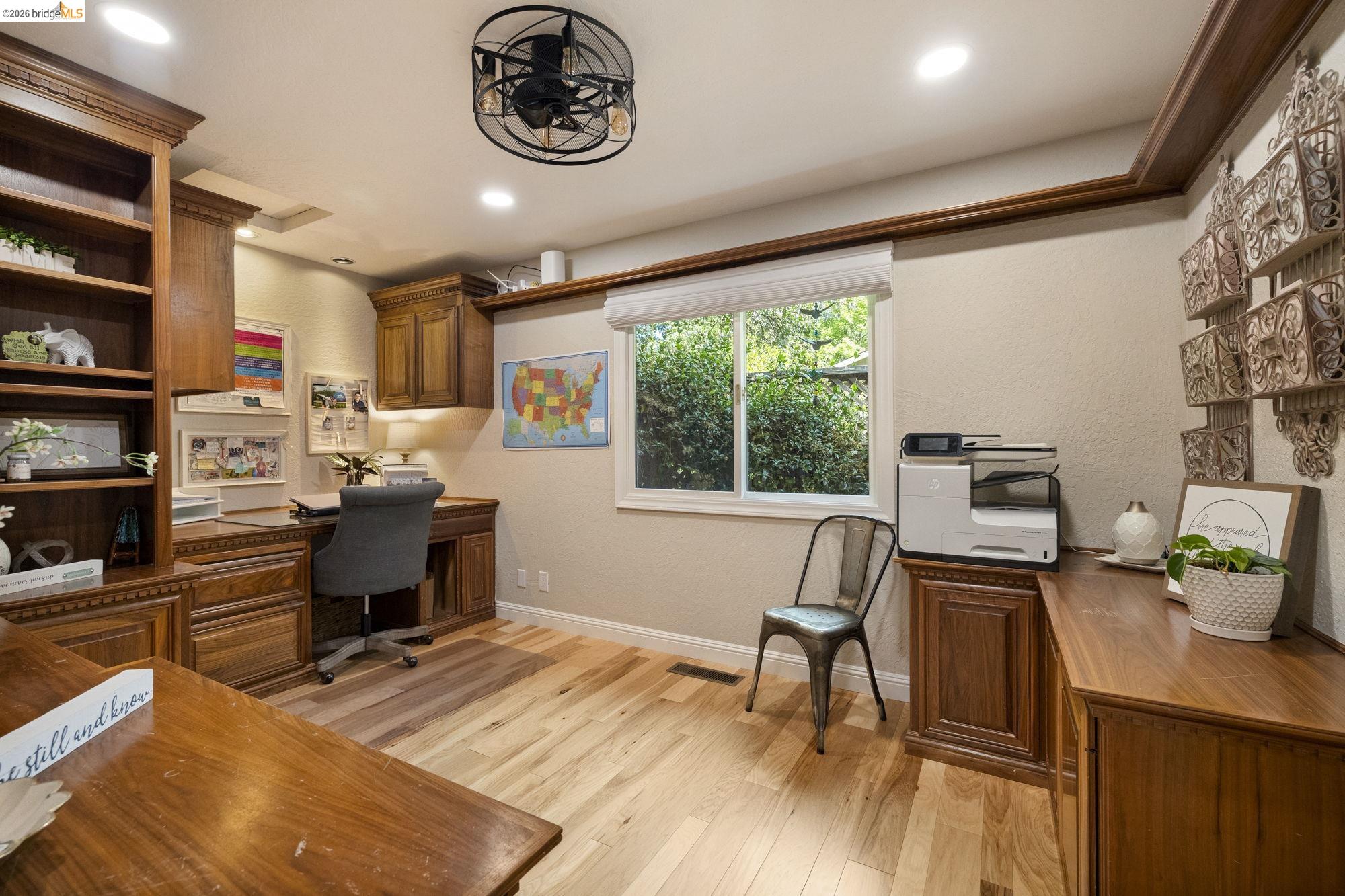 20581 Gerber Road Tuolumne, CA 95379 - Photo 24 of 60 Office area featuring a textured wall, built in desk, light wood finished floors, and recessed lighting