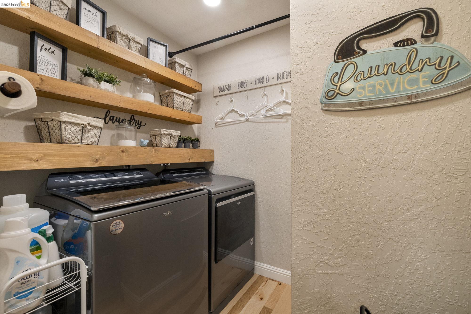 20581 Gerber Road Tuolumne, CA 95379 - Photo 26 of 60 Washroom featuring a textured wall, light wood-style flooring, and independent washer and dryer