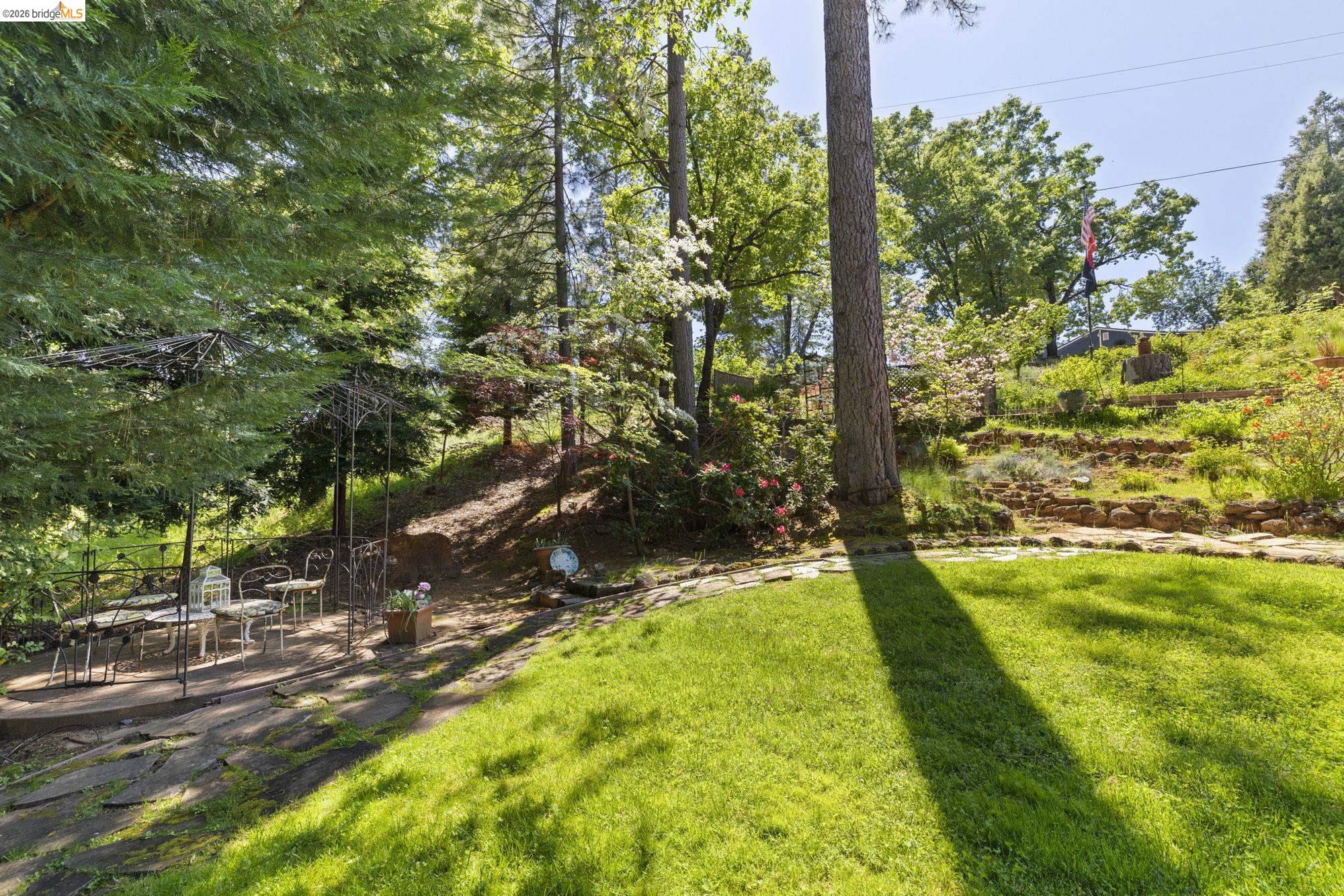 20581 Gerber Road Tuolumne, CA 95379 - Photo 37 of 60 View of grassy yard with a patio area