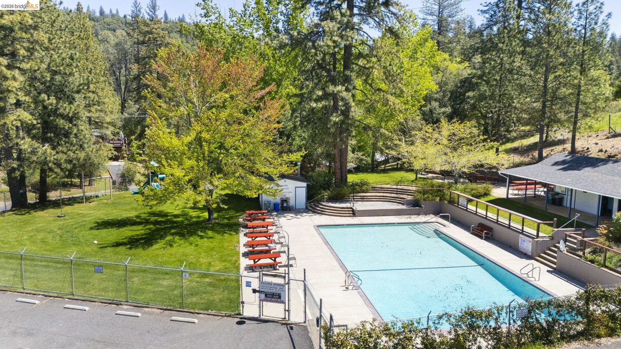 20581 Gerber Road Tuolumne, CA 95379 - Photo 58 of 60 Community pool with a patio area and an outbuilding