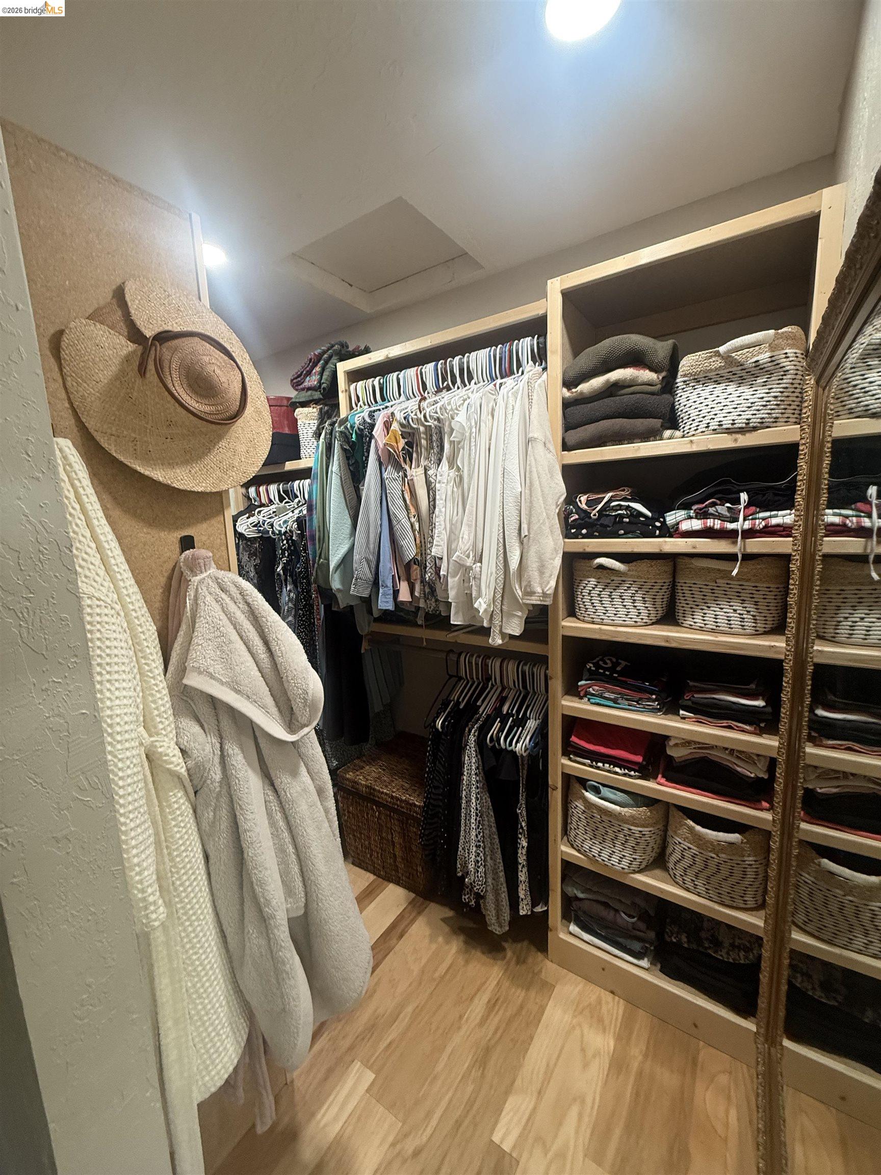 20581 Gerber Road Tuolumne, CA 95379 - Photo 7 of 60 Walk in closet with light wood-type flooring and attic access