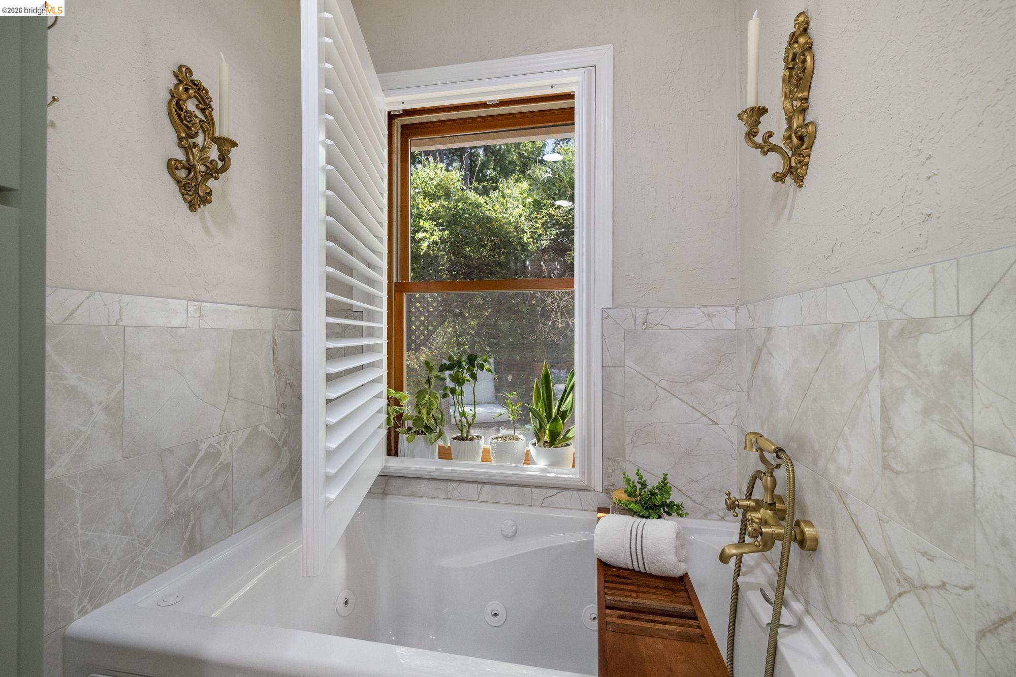 20581 Gerber Road Tuolumne, CA 95379 - Photo 9 of 60 Full bathroom featuring a tub with jets, tile walls, and a textured wall