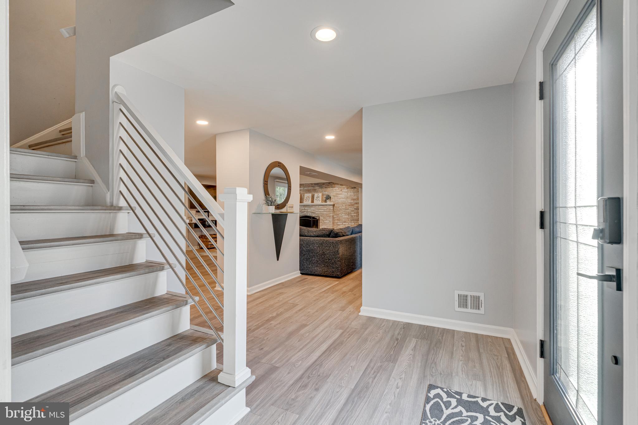 8501 Aqueduct Road Potomac, MD 20854 - Photo 13 of 75 a view of entryway and hall with wooden floor
