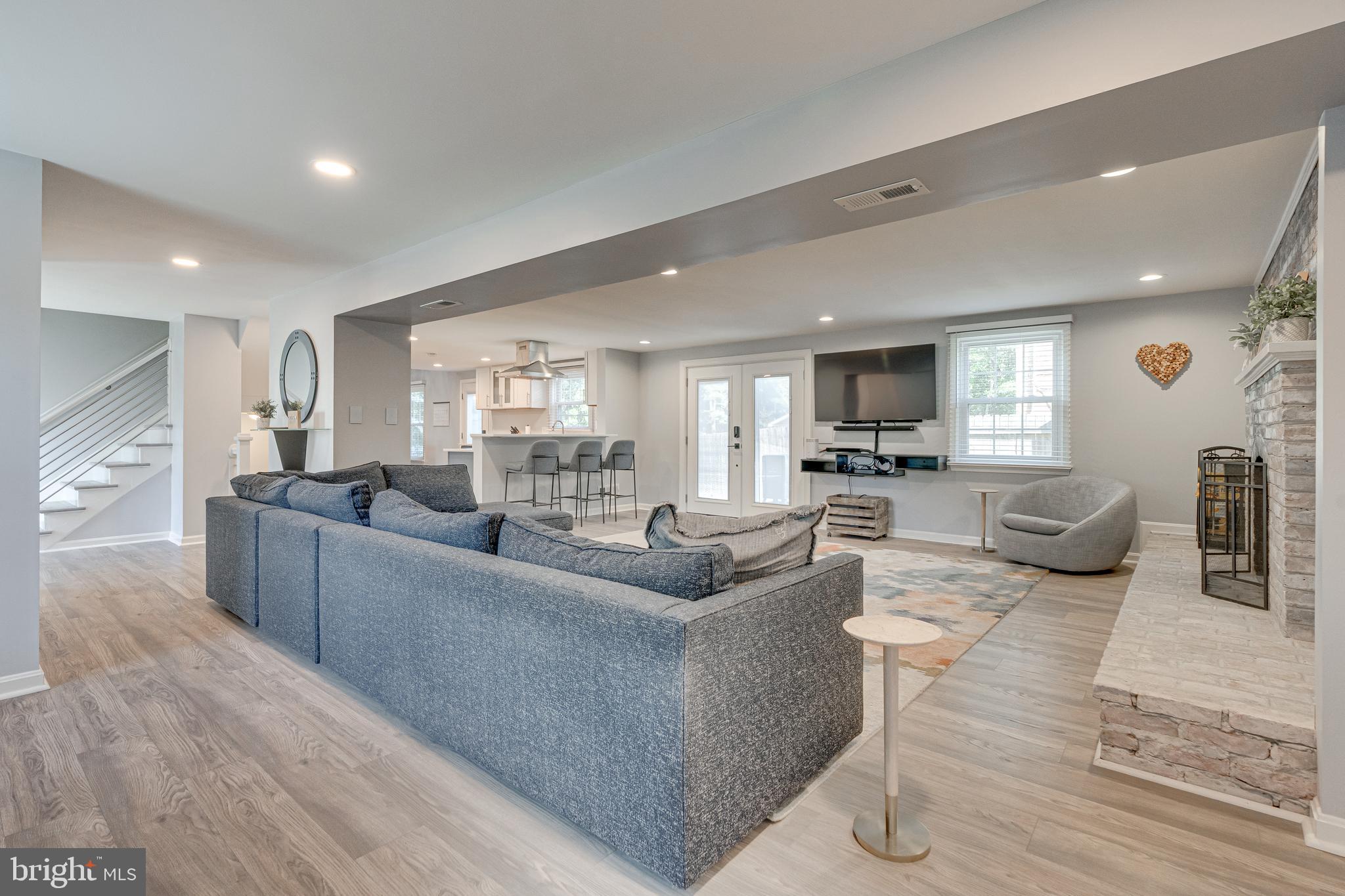 8501 Aqueduct Road Potomac, MD 20854 - Photo 15 of 75 a living room with furniture wooden floor and a view of kitchen