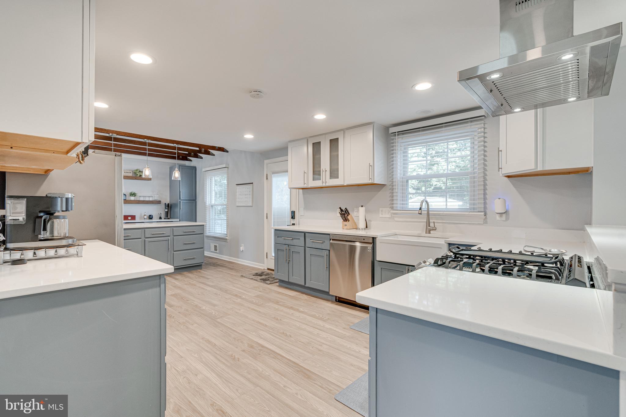 8501 Aqueduct Road Potomac, MD 20854 - Photo 19 of 75 a kitchen with a sink stove and cabinets