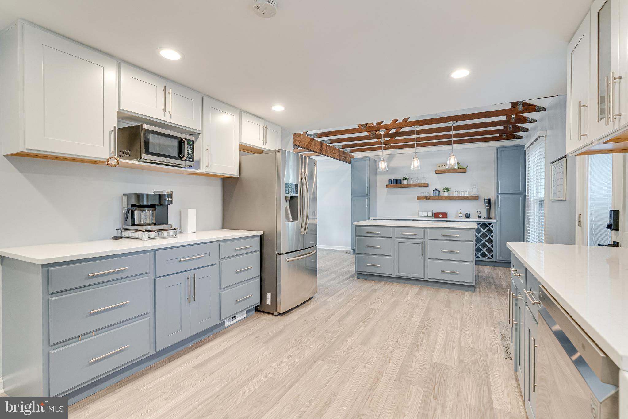 8501 Aqueduct Road Potomac, MD 20854 - Photo 23 of 75 a kitchen with stainless steel appliances a sink and cabinets