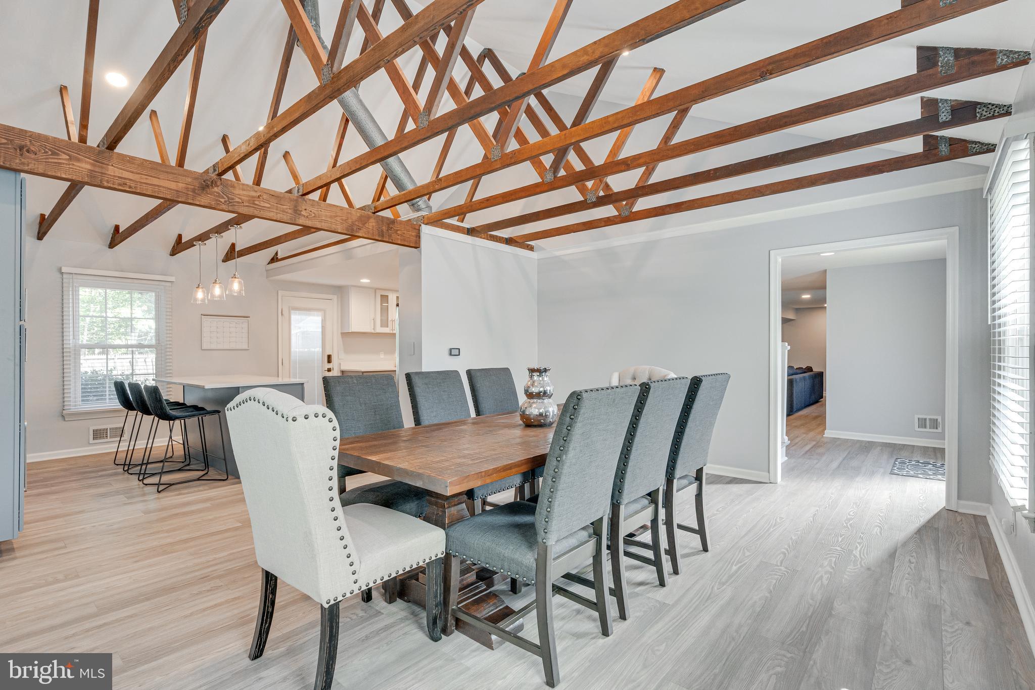 8501 Aqueduct Road Potomac, MD 20854 - Photo 23 of 54 a view of a dining room with furniture and wooden floor