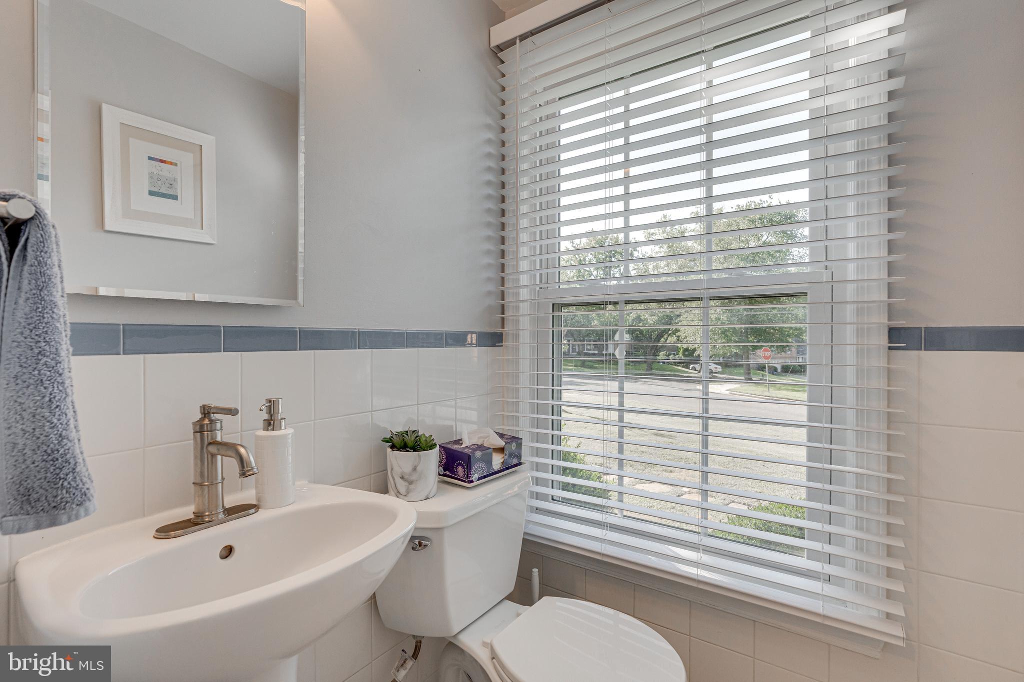 8501 Aqueduct Road Potomac, MD 20854 - Photo 24 of 54 a bathroom with a sink and a mirror