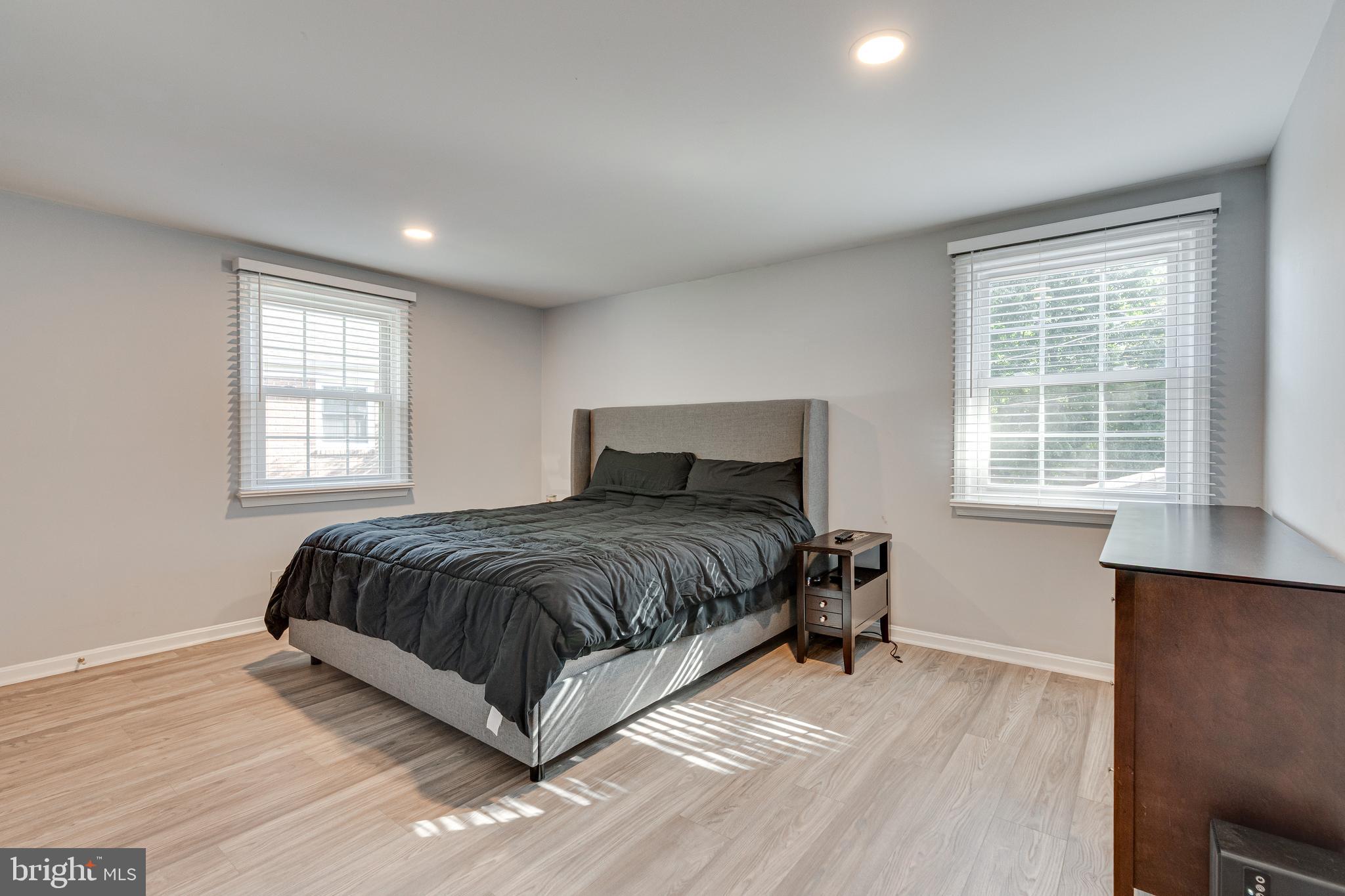 8501 Aqueduct Road Potomac, MD 20854 - Photo 25 of 54 a bedroom with a bed and wooden floor