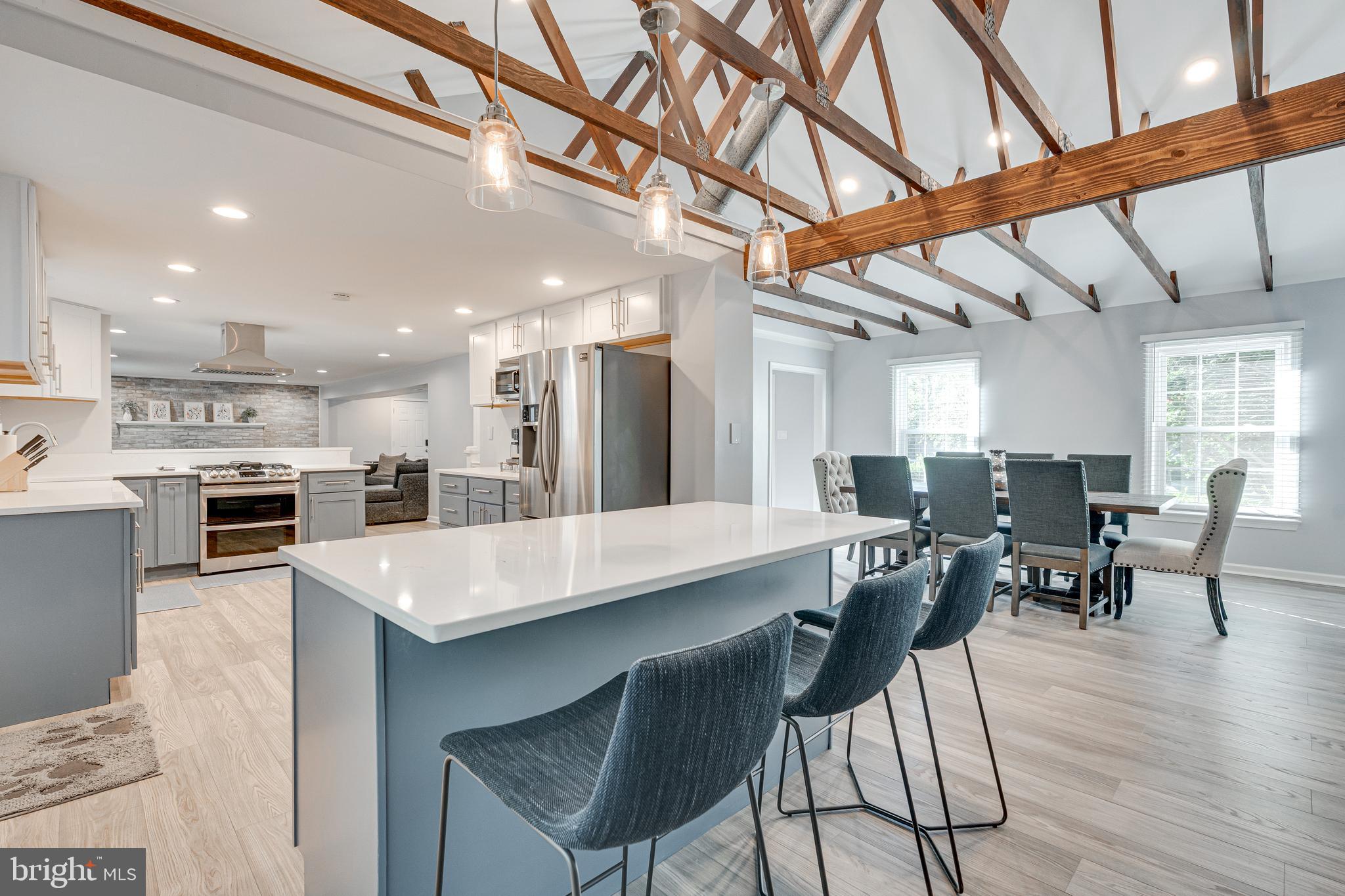 8501 Aqueduct Road Potomac, MD 20854 - Photo 27 of 75 a large kitchen with a table and chairs