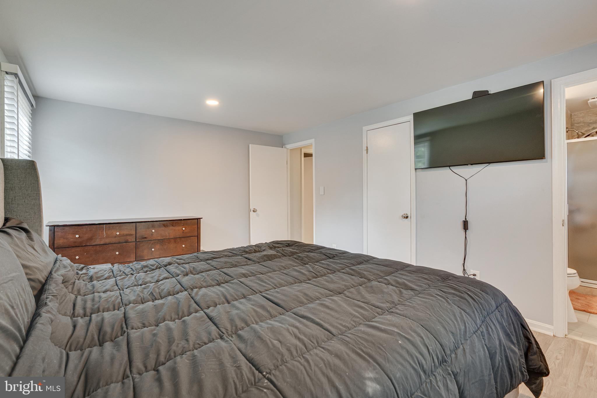 8501 Aqueduct Road Potomac, MD 20854 - Photo 32 of 75 a bedroom with a bed and a flat screen tv