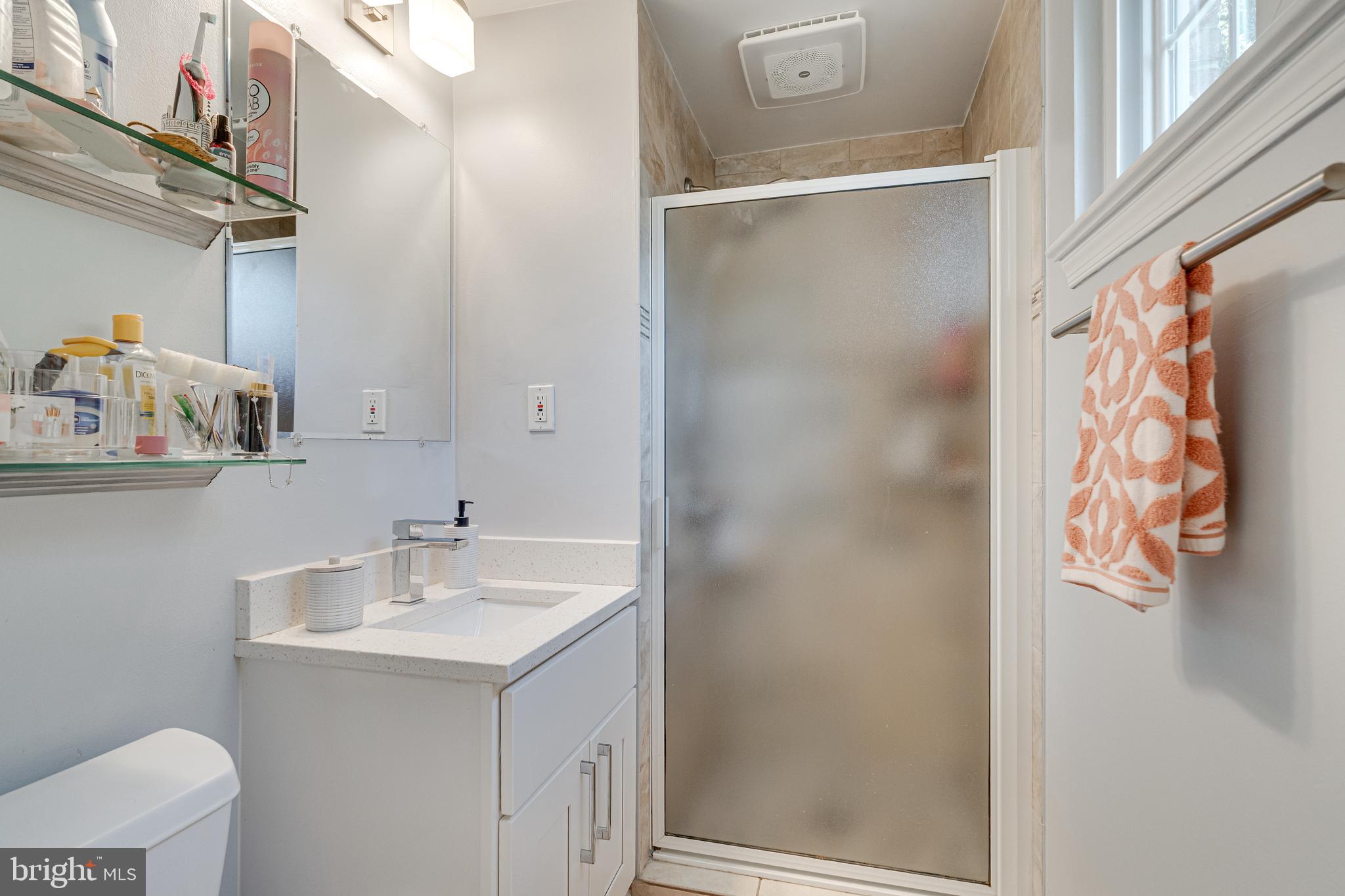 8501 Aqueduct Road Potomac, MD 20854 - Photo 33 of 75 a bathroom with a sink and mirror