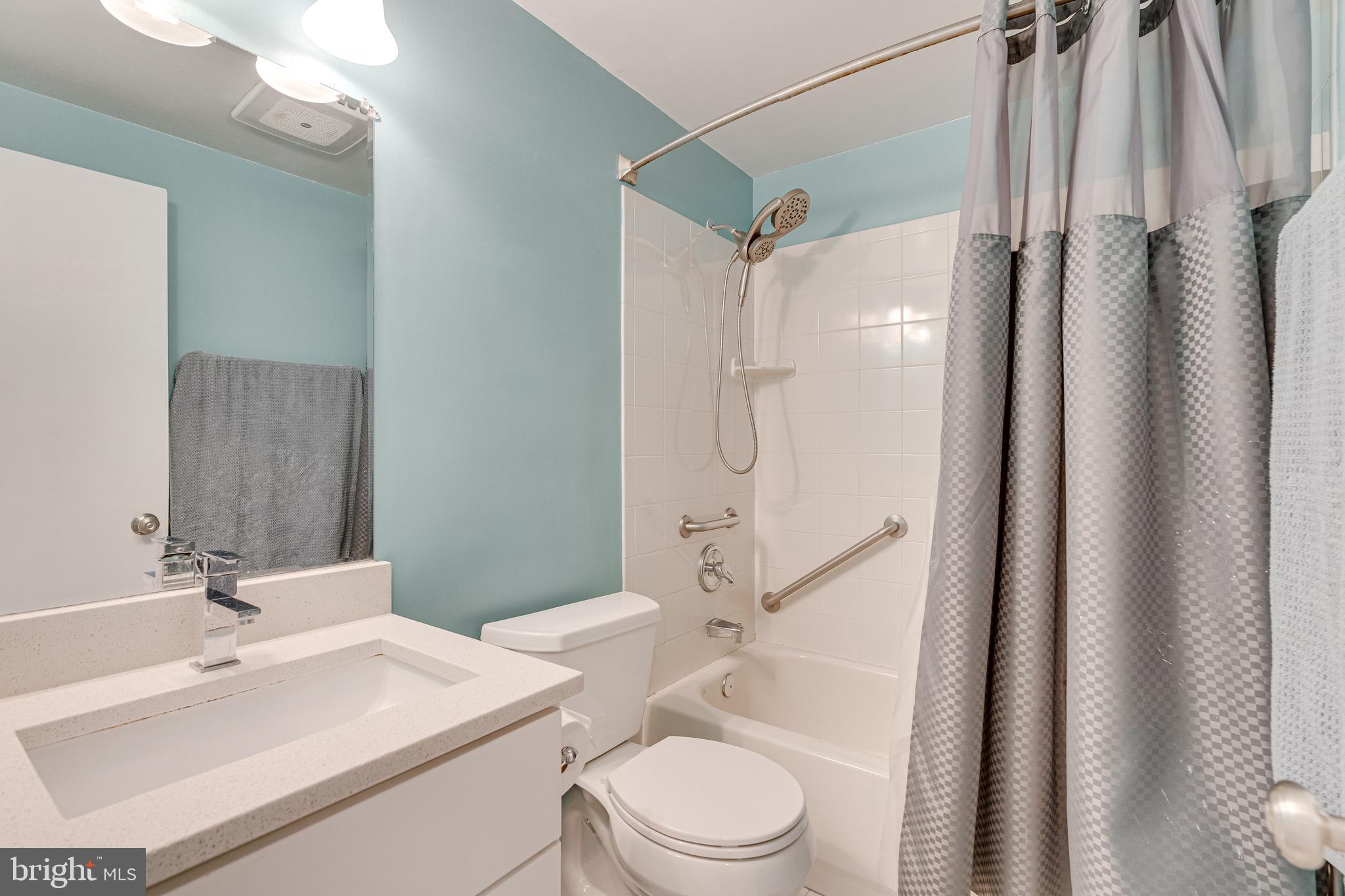 8501 Aqueduct Road Potomac, MD 20854 - Photo 34 of 54 a bathroom with a sink toilet vanity and shower