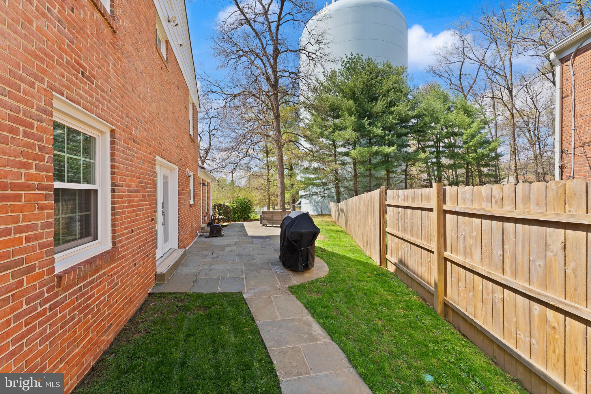 8501 Aqueduct Road Potomac, MD 20854 - Photo 43 of 54 a view of a house with backyard and sitting area