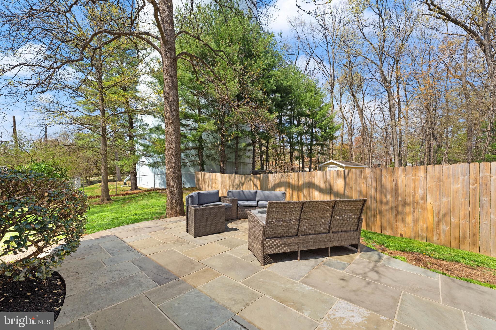8501 Aqueduct Road Potomac, MD 20854 - Photo 44 of 54 a view of backyard with seating space and green space