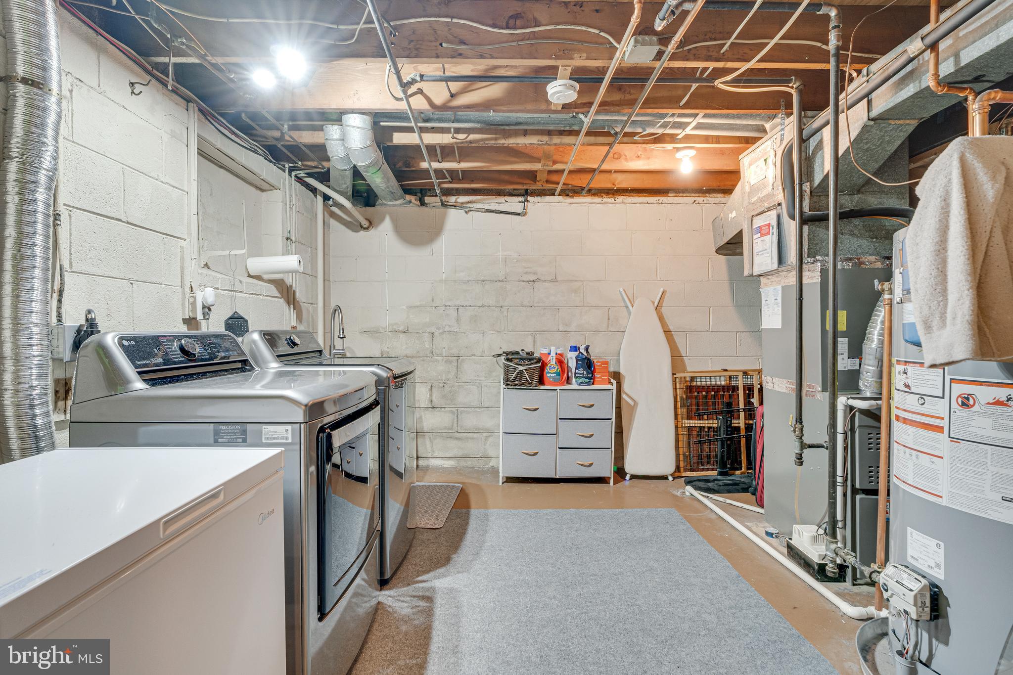 8501 Aqueduct Road Potomac, MD 20854 - Photo 45 of 75 a storage room with washer and dryer