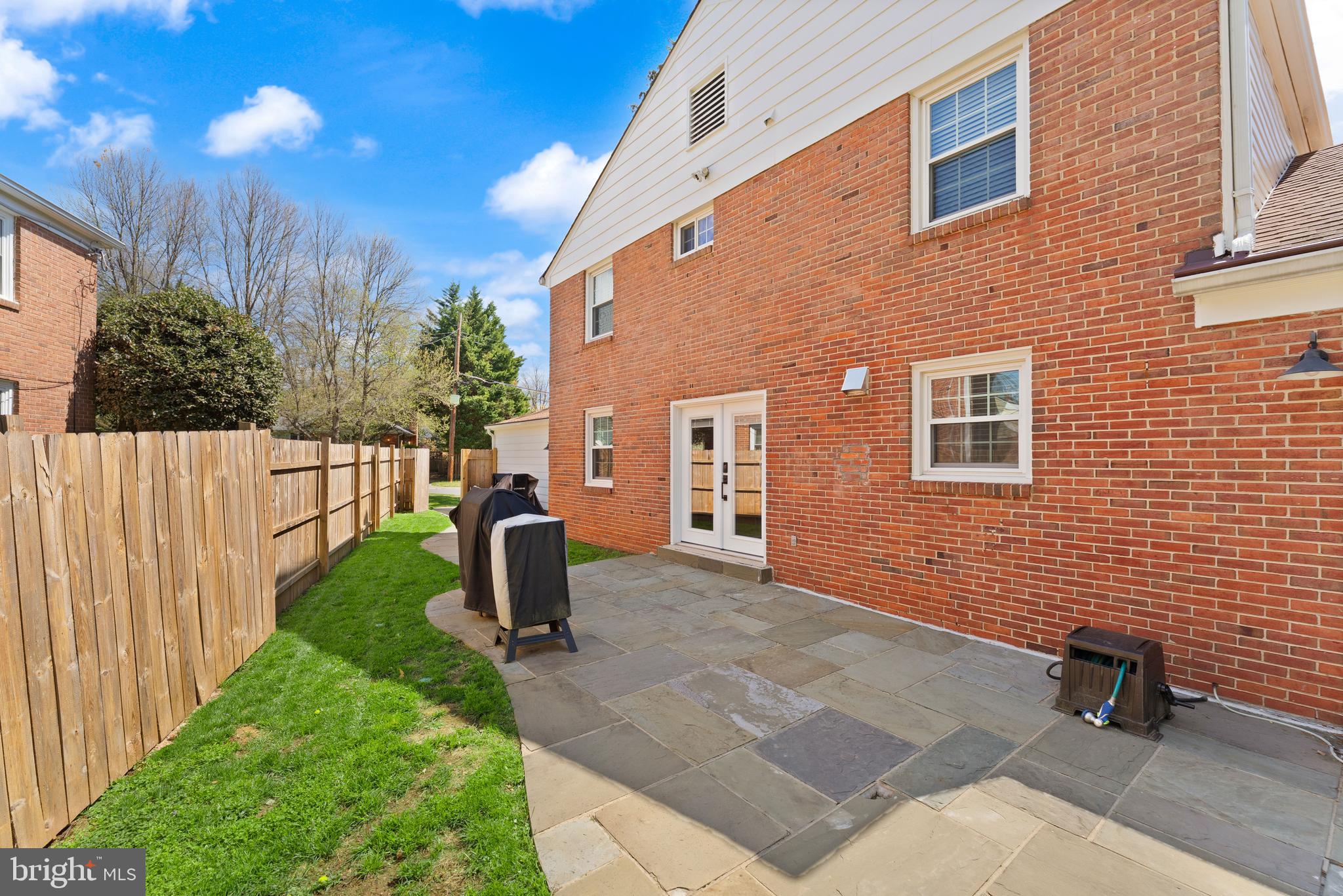 8501 Aqueduct Road Potomac, MD 20854 - Photo 50 of 75 a front view of a house with garden