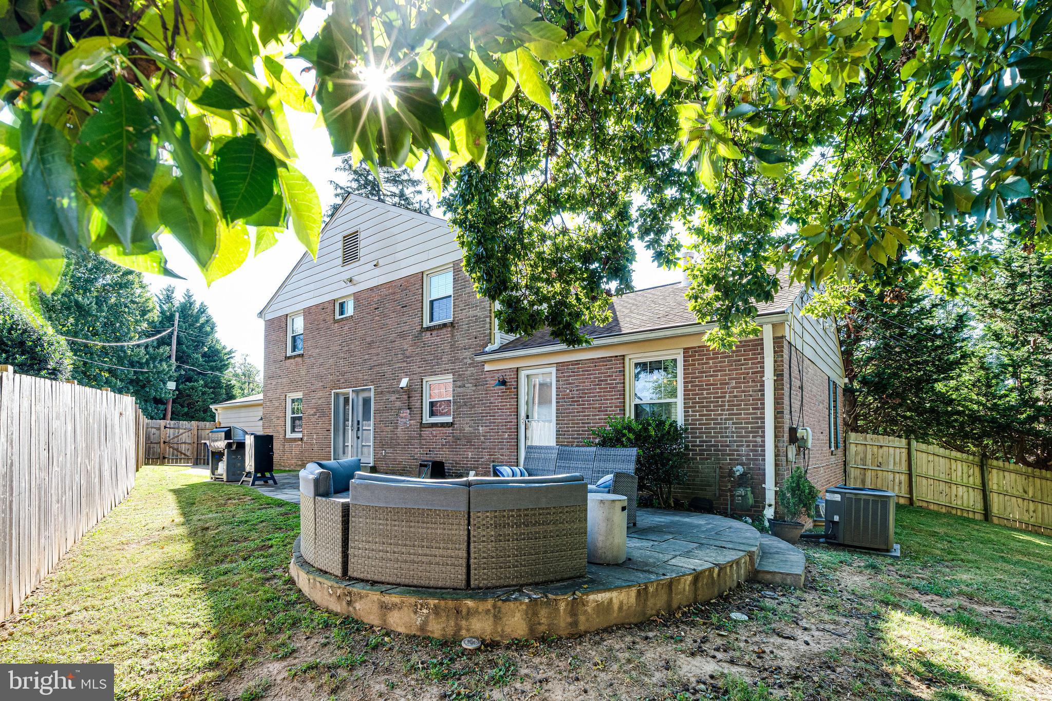 8501 Aqueduct Road Potomac, MD 20854 - Photo 53 of 75 a view of a house with backyard and sitting area