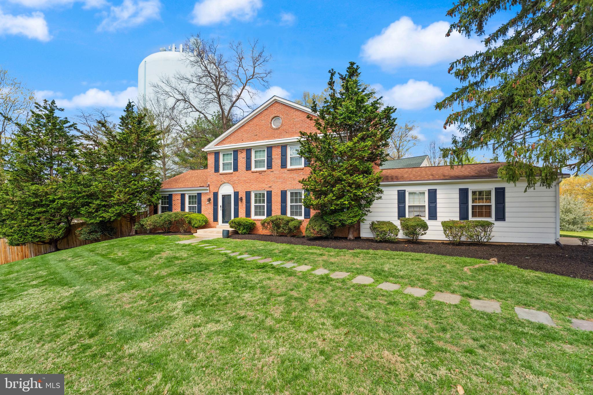 8501 Aqueduct Road Potomac, MD 20854 - Photo 6 of 75 a front view of a house with a garden